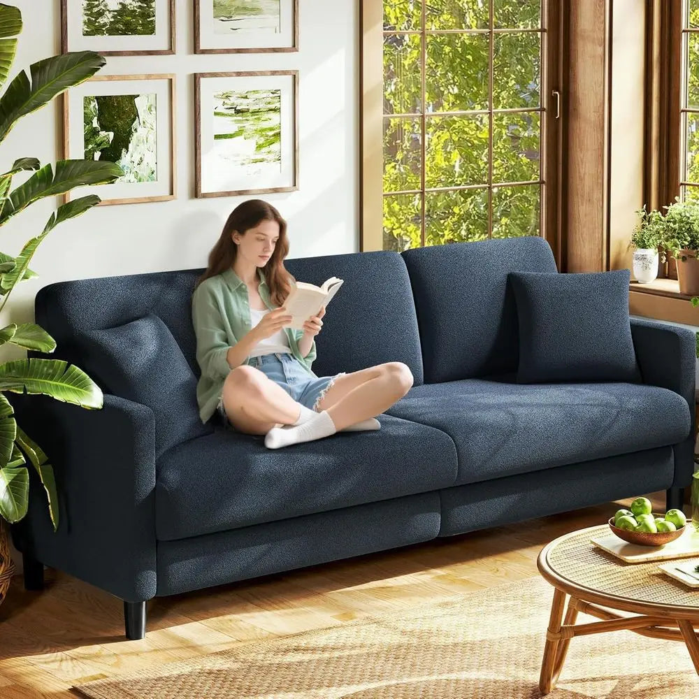 Cozy Living Room Sofa With Pillows And Wooden Loveseat